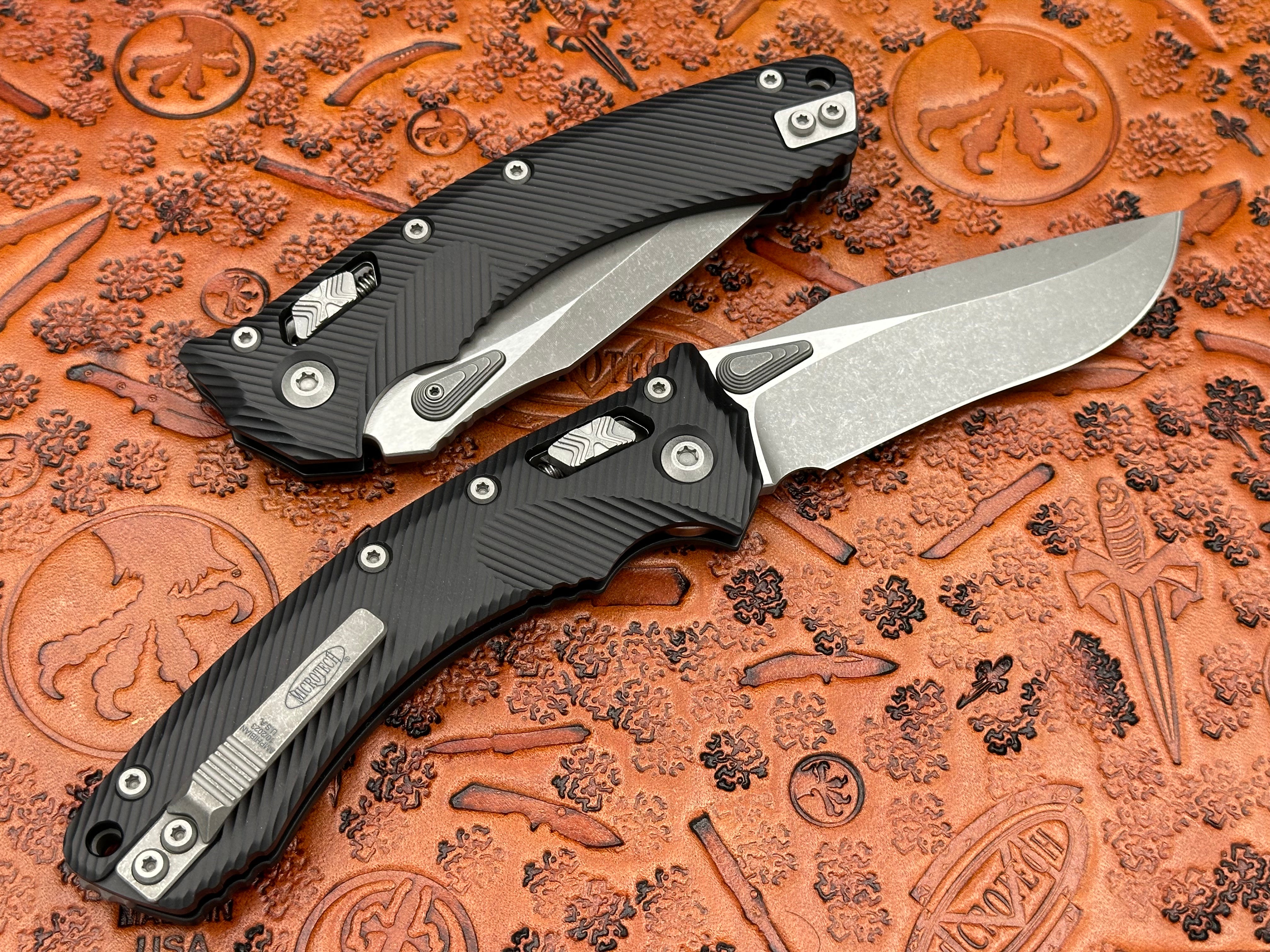 Microtech Knives Amphibian RAM-LOK Black Single Edge Fluted Aluminum Black Apocalyptic 137RL-1-APFL - Tristar Edge